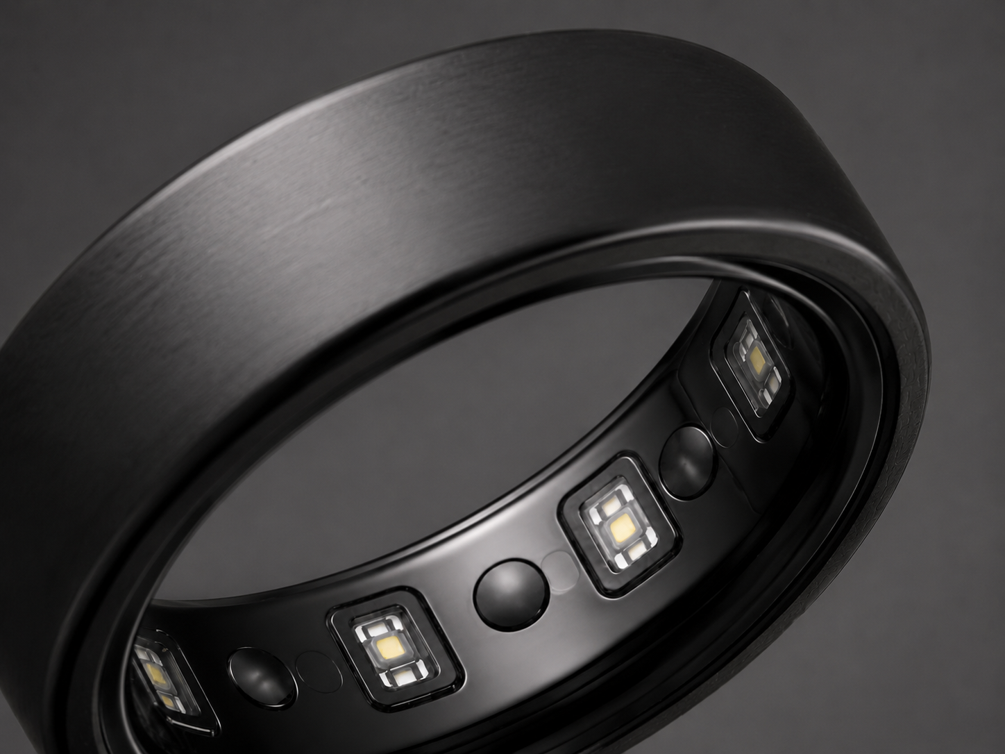 Inner surface of the matte black screenless HealthRing showing the sensor array